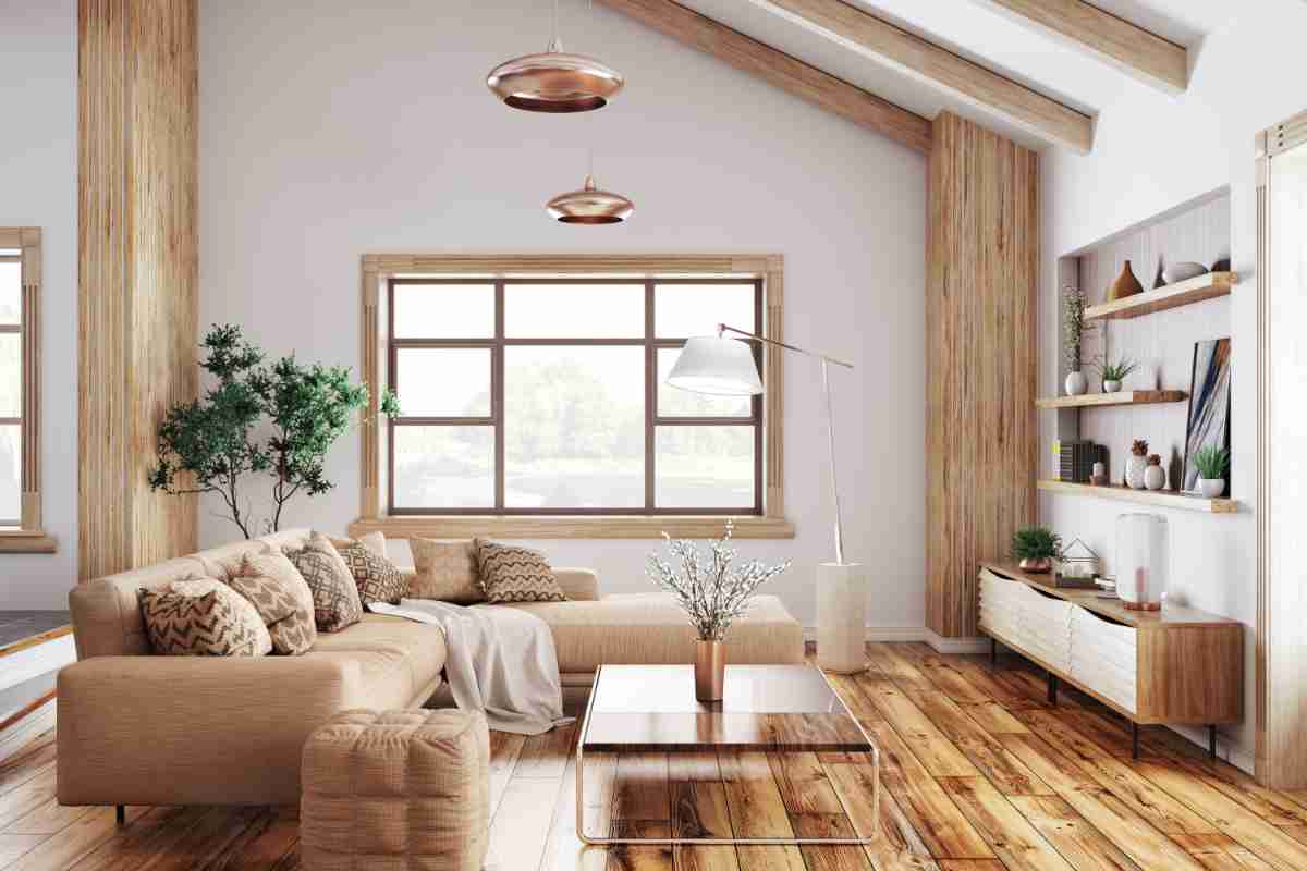 Salotto in soggiorno tortora con travi e vista ed elementi strutturali in legno