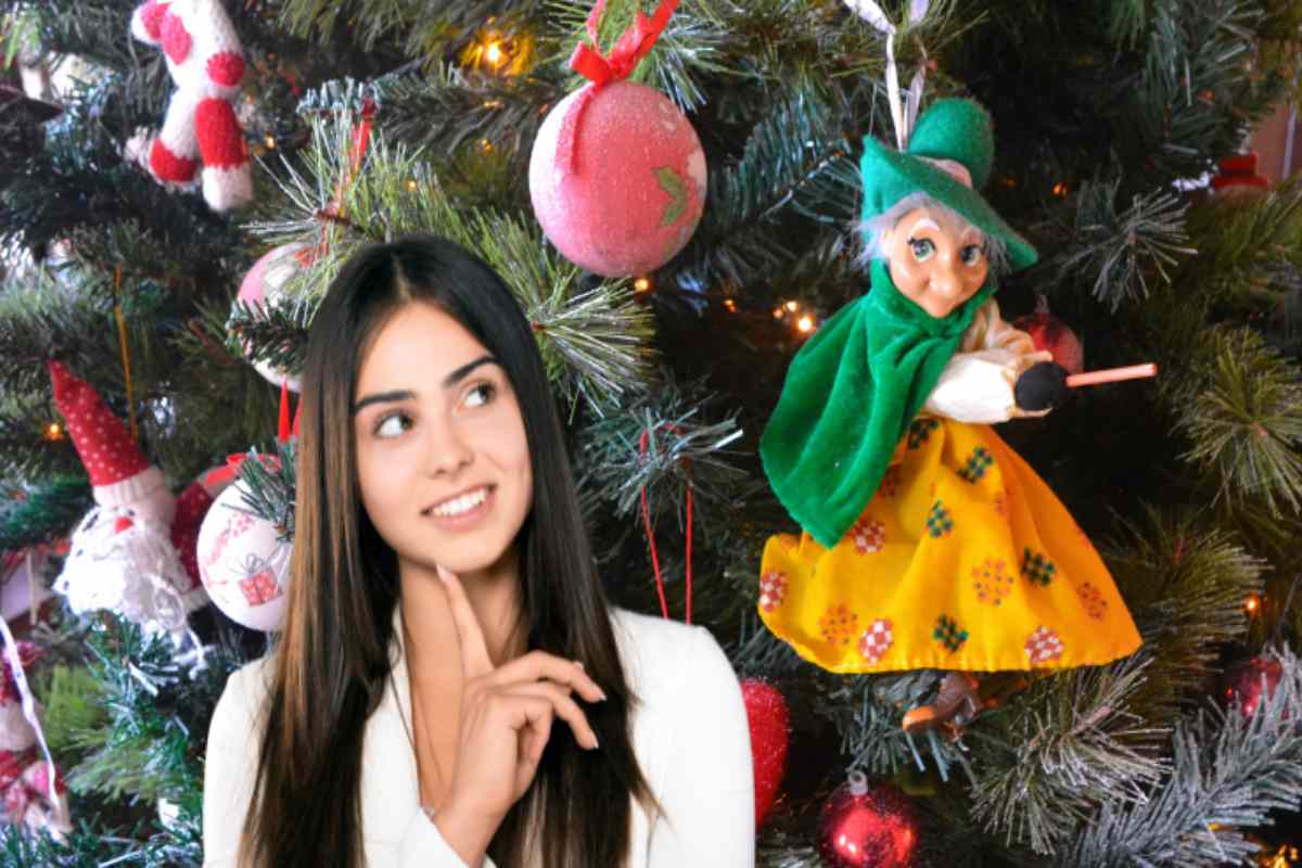 befana su albero ragazza riflette